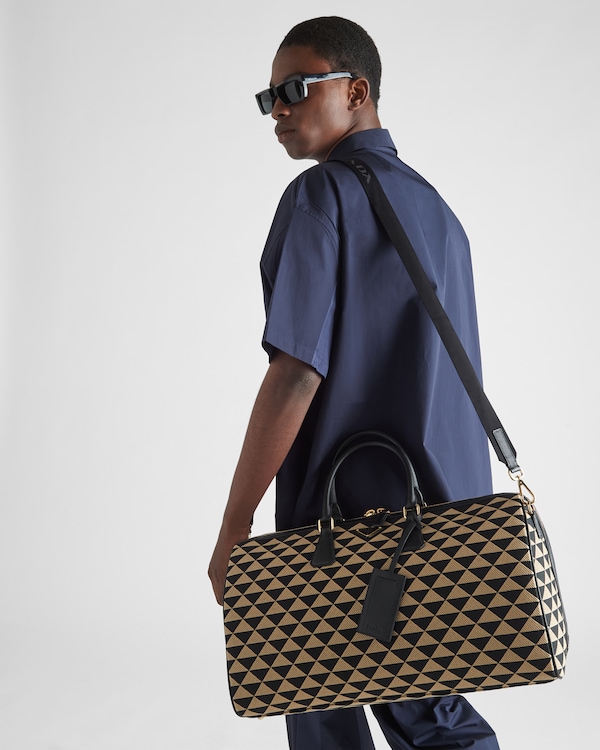 Large Prada Symbole embroidered fabric travel bag - Black/Beige Large Prada Symbole embroidered fabric travel bag - Black/Beige