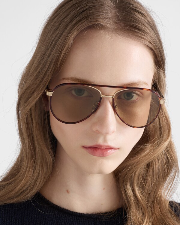 Prada sunglasses with the iconic metal plaque - Camomile Lenses Prada sunglasses with the iconic metal plaque - Camomile Lenses