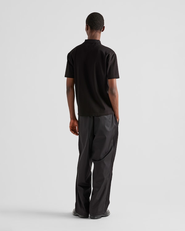 Piqué polo shirt with Re-Nylon details - Black Piqué polo shirt with Re-Nylon details - Black
